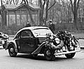 A Skoda Rapid on its return from the 1937 Rally Monte Carlo in front of the Automobile Club headquarters in Prague. 